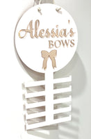 Bow, headband holder